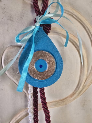 Handmade eye charm from porcelain with a summer touch