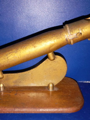 Vintage lighter used, tabletop cannon-shaped with wooden base