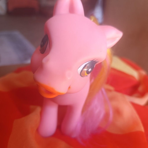 Large pink pony toy with colorful mane and tail