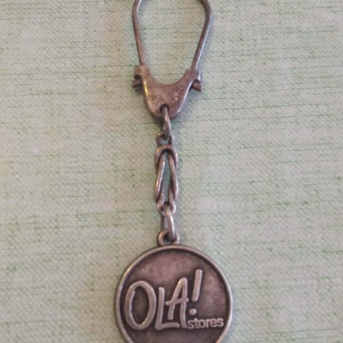 Ola! Stores Vintage Metal Keychain used, 2000s promotional
