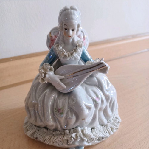Porcelain vintage decorative girl with mandolin used