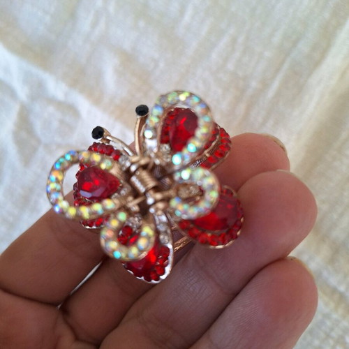 Small butterfly hair clip used with red rhinestones