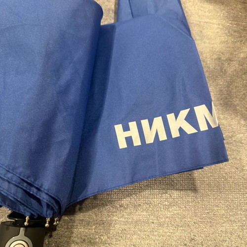 Blue folding umbrella branded with NIKMI AD new