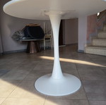 Round dining table with white MDF surface