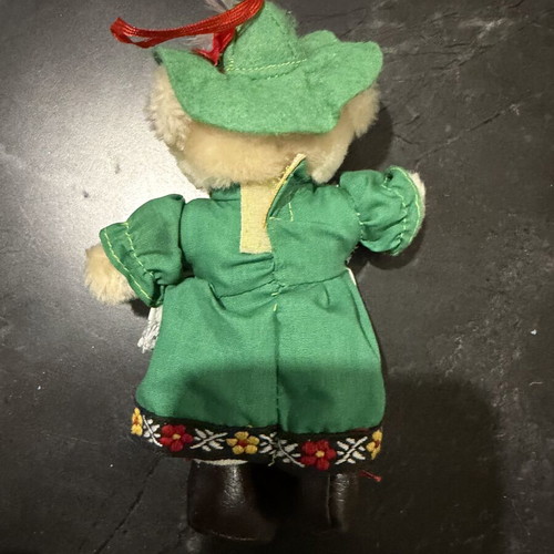 Small plush teddy bear with traditional costume used