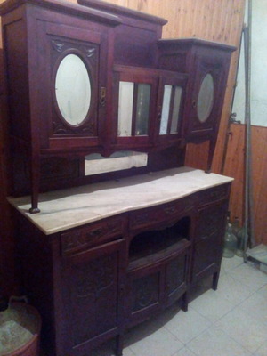 Carved sideboard used, over 100 years old, with marble and glass
