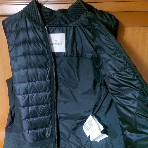 Moncler sleeveless vest used with pleat detail at back, black