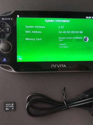 Sony PlayStation Vita PCH-1004 OLED used with memory and USB charger