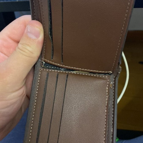 Wallet used, brown with fabric tear at cash compartment