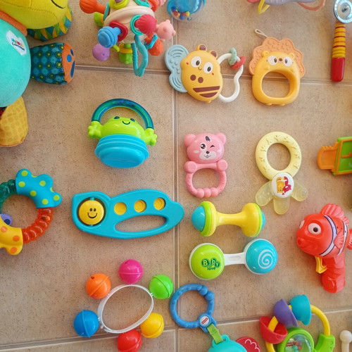 Set of 32 baby rattles including plush toys and large dice