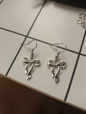 Silver Bow Earrings handmade with plastic stoppers