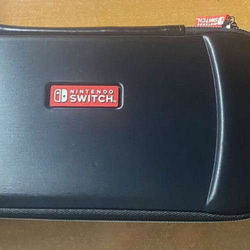 Nintendo Switch like new with 4 games and travel case