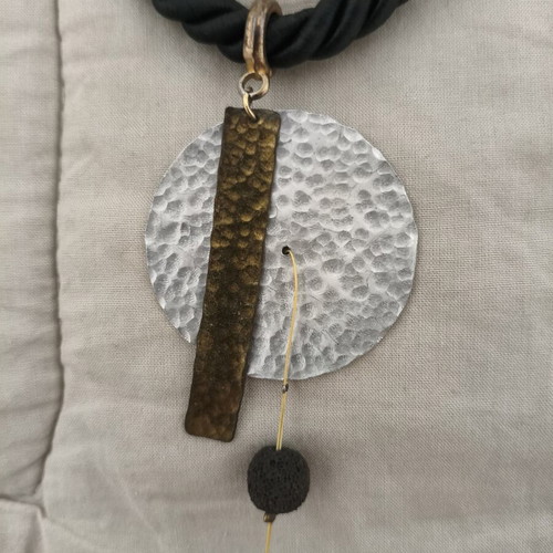 Statement handmade necklace with black rope and hammered metal elements like new