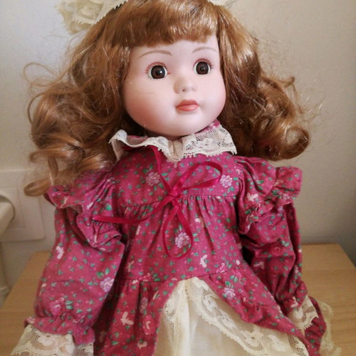Porcelain doll used, 38cm tall with clothes and shoes