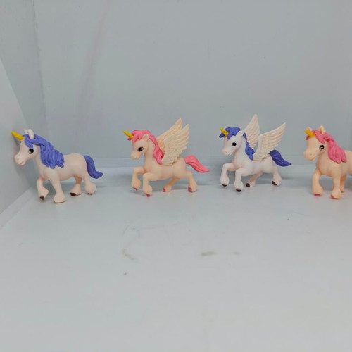 Set of 4 unicorn and pegasus figures like new