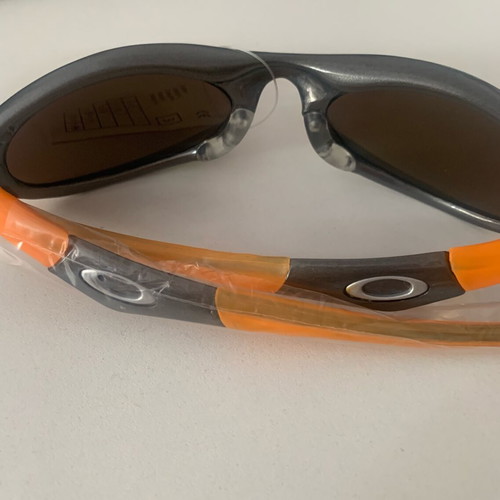 Oakley sunglasses, orange with gold lime chameleon lenses