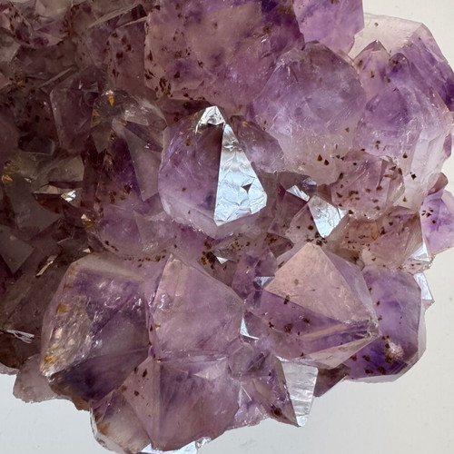 Decorative quartz parrot on raw amethyst base like new