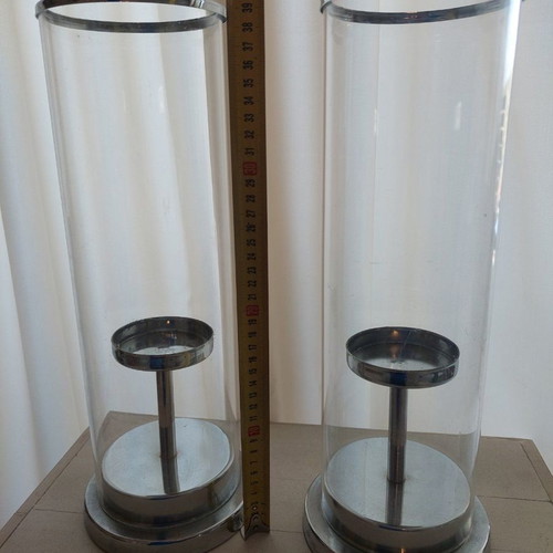 Set of 2 used candlesticks with silver frame and transparent glass