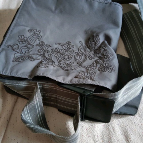 Lassig changing bag used, messenger with strap and spacious compartments