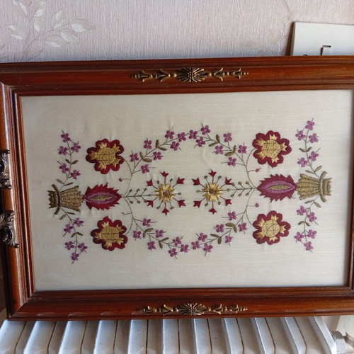 Decorative wooden tray with embroidered flowers and brass handles