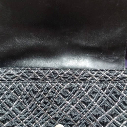 Black shoulder bag with embossed geometric pattern, like new
