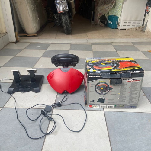 Video game steering wheel with Ferrari pedals and PlayStation One like new