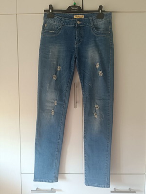 Blue jeans size 44 used with rips, 95% cotton 5% elastane