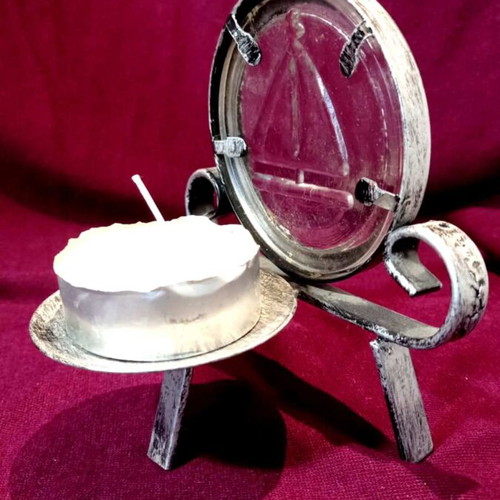 Metal tealight holder like new with glass sailboat decoration