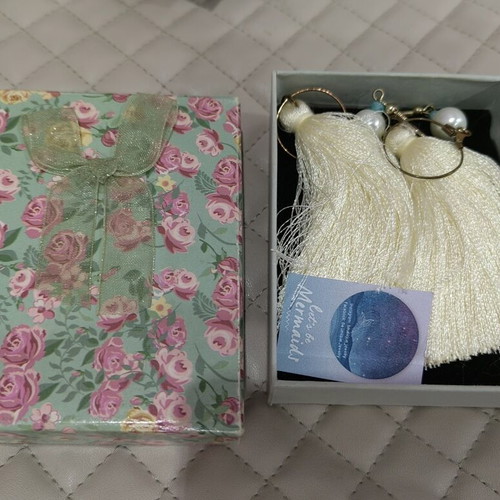 Earrings used with white tassels