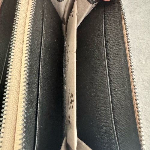 Beige wallet with designs like new