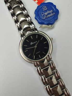 Vintage Regalle Swiss Made NOS watch black dial 35mm