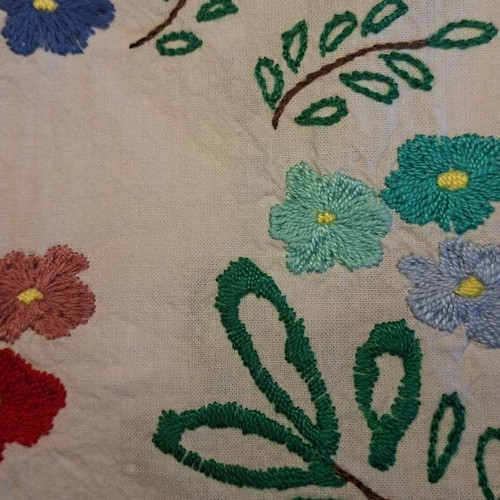 Vintage handmade embroidered tablecloth with flowers and needlework