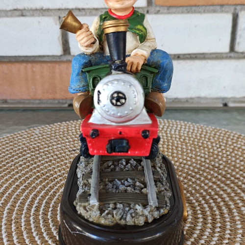 Decorative figure with motion sensor used, train engineer on locomotive