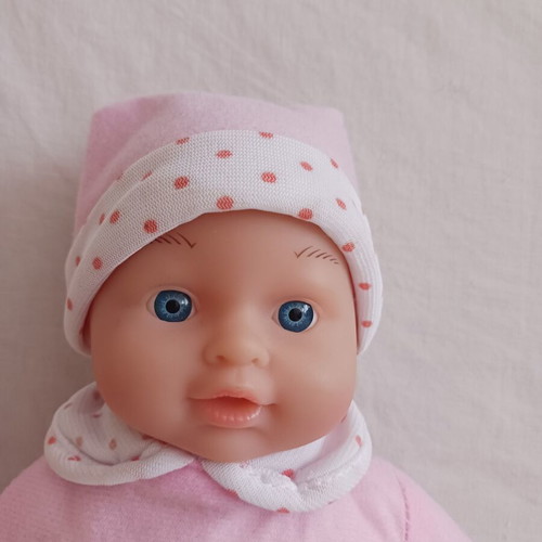 Baby doll with pink clothes like new