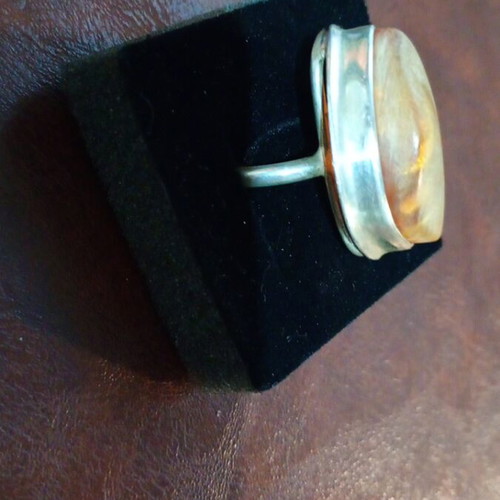 Silver women's ring with amber used