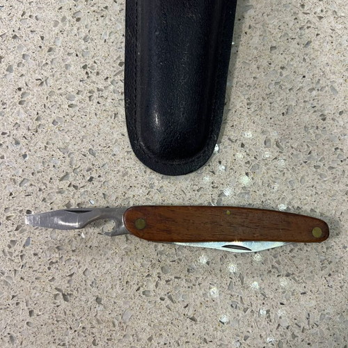 Folding knife used from 1980s with sheath