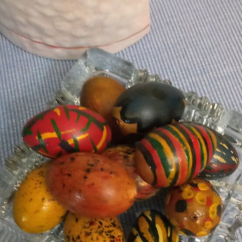 Metal rabbit and 10 hand-painted wooden eggs like new