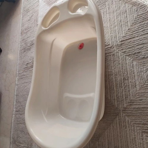 Baby Bathtub like new, beige with anti-slip surface and drain plug