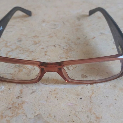 Miu Miu eyeglasses used with purple and orange acetate frame