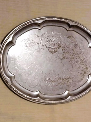 Silver-plated serving tray used with ornate handles