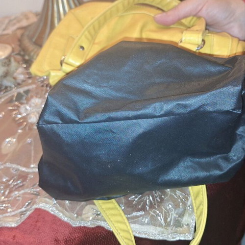 Women's mustard small hand bag used
