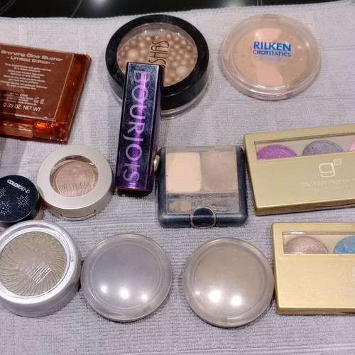 Cosmetics set used with eyeshadows, blushes, lipstick, and lip gloss