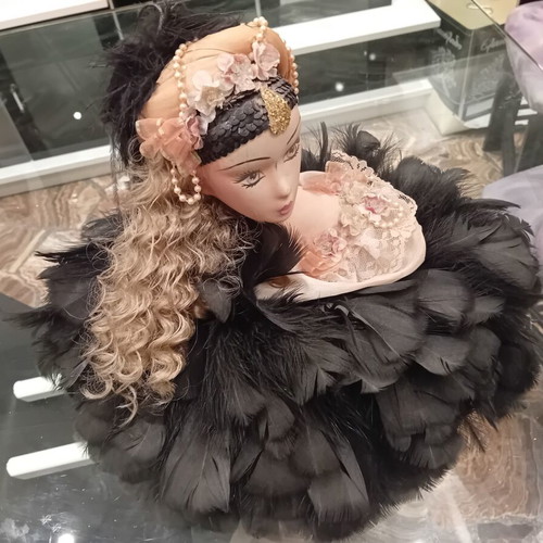 Vintage porcelain doll with feathers, handpainted, used