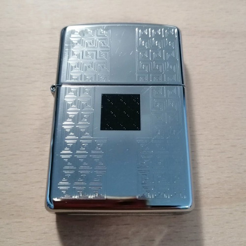 Zippo lighter used with meander pattern designs