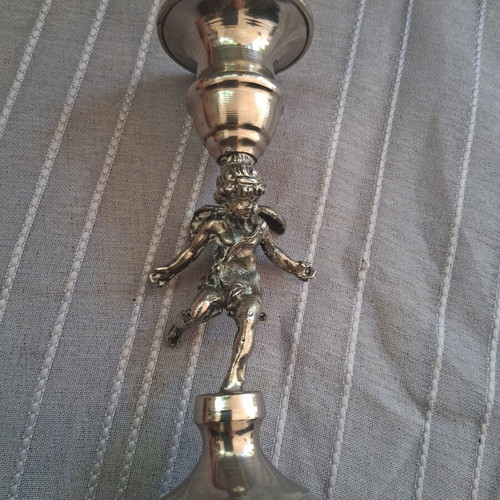 Vintage candlestick with cherub figure