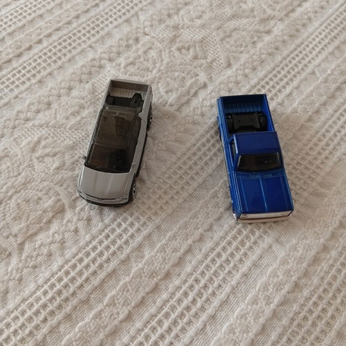 Hot Wheels Chevy Silverado and Chevrolet Silverado EV toy cars like new, pack of 2