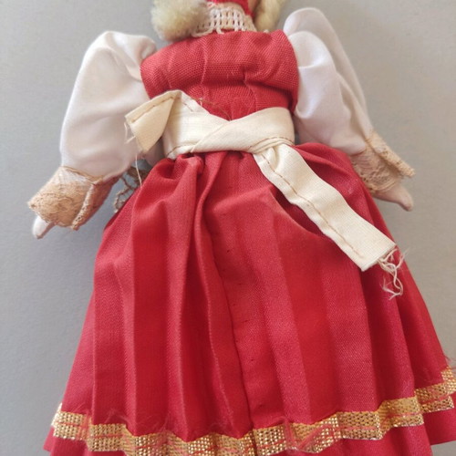 Vintage doll used with porcelain head and embroidered apron
