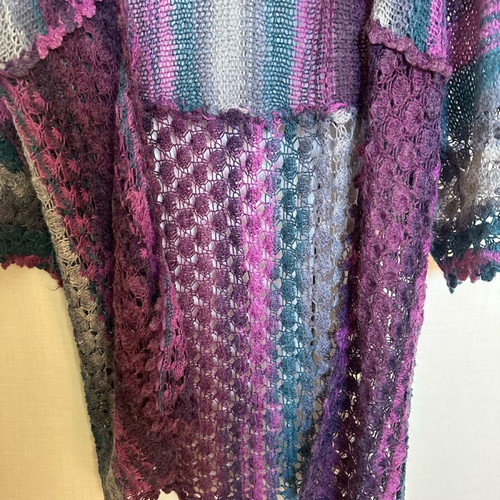 Knitted cardigan like new, multicolored with two patterns