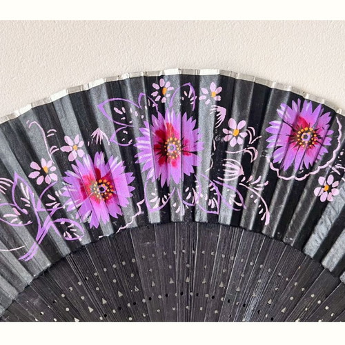 Handpainted fan used, black with floral design, wood and textile