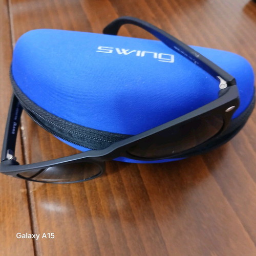 Swing sunglasses new with black plastic frame and men's lenses